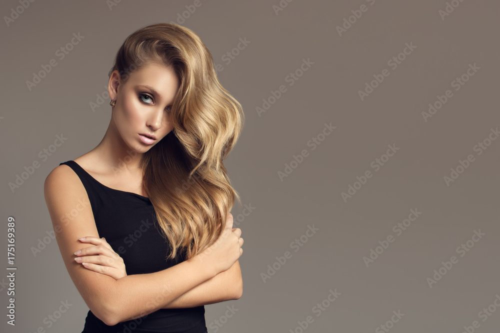 Blond woman with long curly beautiful hair. Blond woman with long curly beautiful hair.