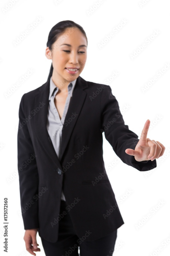 Businesswoman pressing an invisible virtual screen Businesswoman pressing an invisible virtual screen