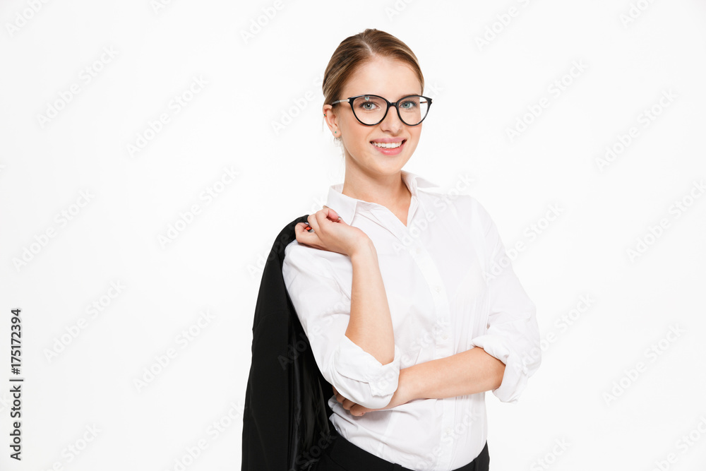 Smiling blonde business woman in eyeglasses holding her jacket Smiling blonde business woman in eyeglasses holding her jacket
