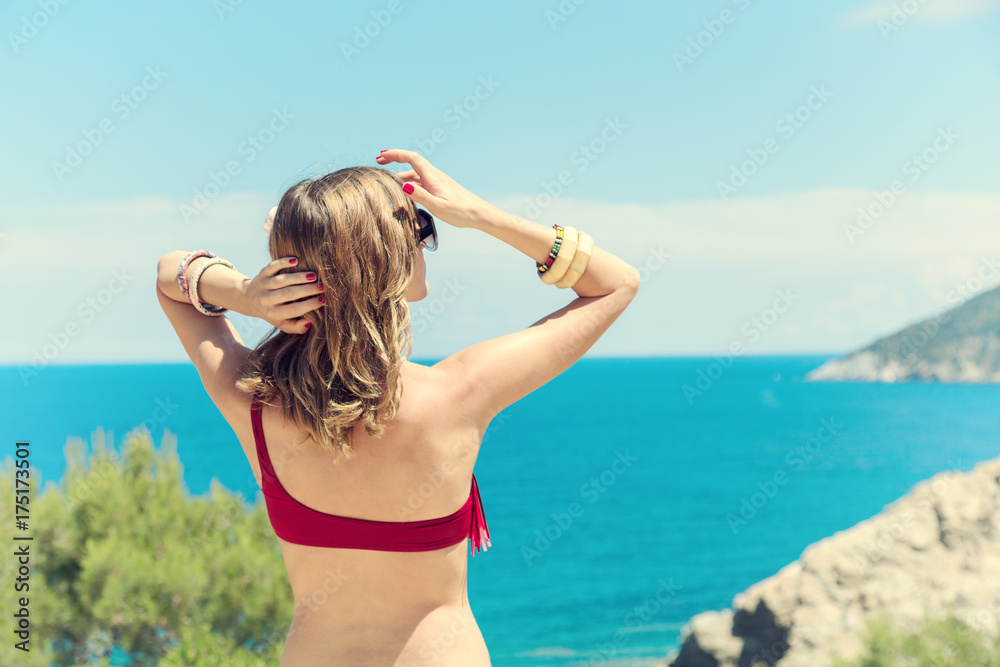Young woman enjoying the summer with ocean / sea view. Young woman enjoying the summer with ocean / sea view.