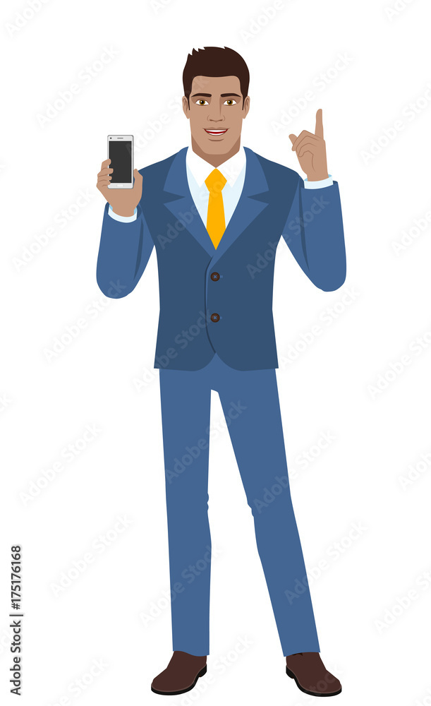 Businessman holding mobile phone and pointing up Businessman holding mobile phone and pointing up