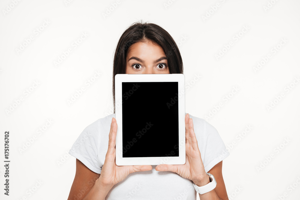 Portrait of a young brunette woman covering face Portrait of a young brunette woman covering face