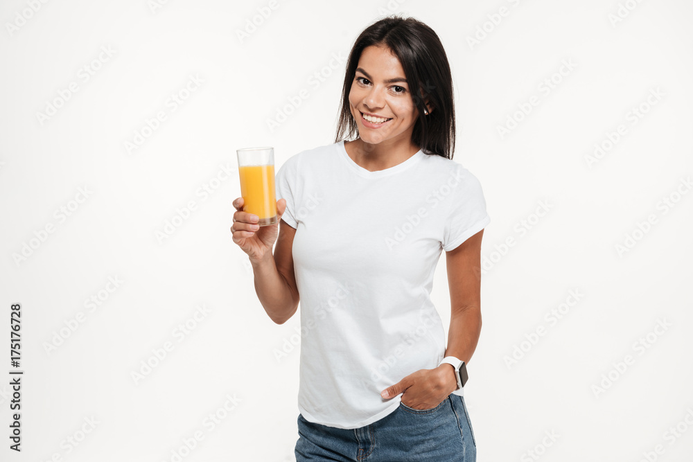 Portrait of a woman holding glass of an orange juice Portrait of a woman holding glass of an orange juice