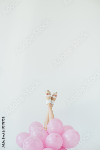 female legs and balloons