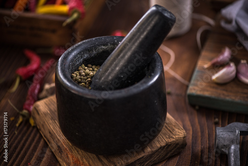 Green pepper seeds in stone mortar