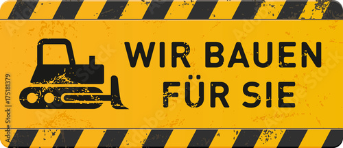 gelbes Schild Wir bauen für Sie mit Planierraupe-Icon