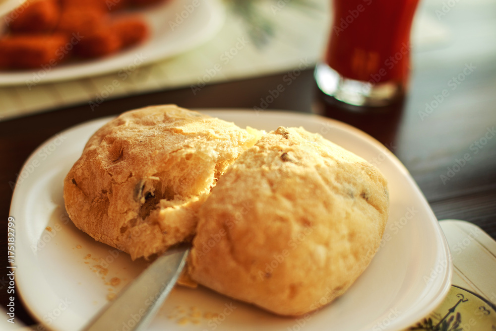 man cuts fresh bread with a knife man cuts fresh bread with a knife