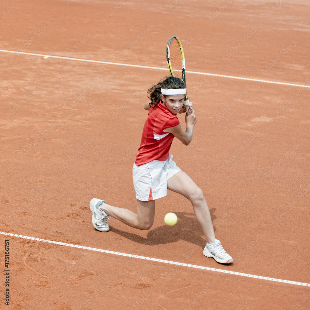 Young tennis player in action