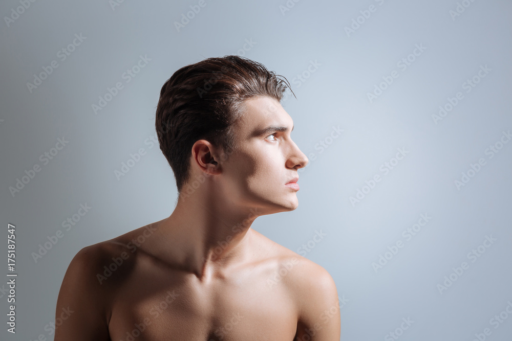 Profile photo of serious man that turning head Profile photo of serious man that turning head