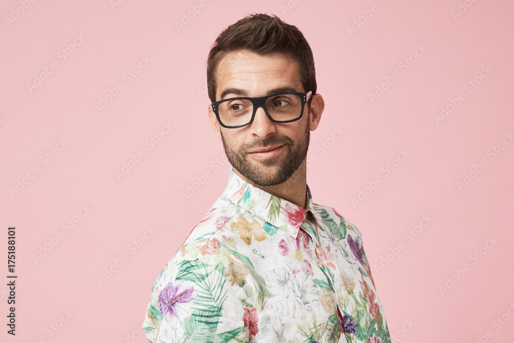 Guy in glasses and shirt, looking over shoulder Guy in glasses and shirt, looking over shoulder