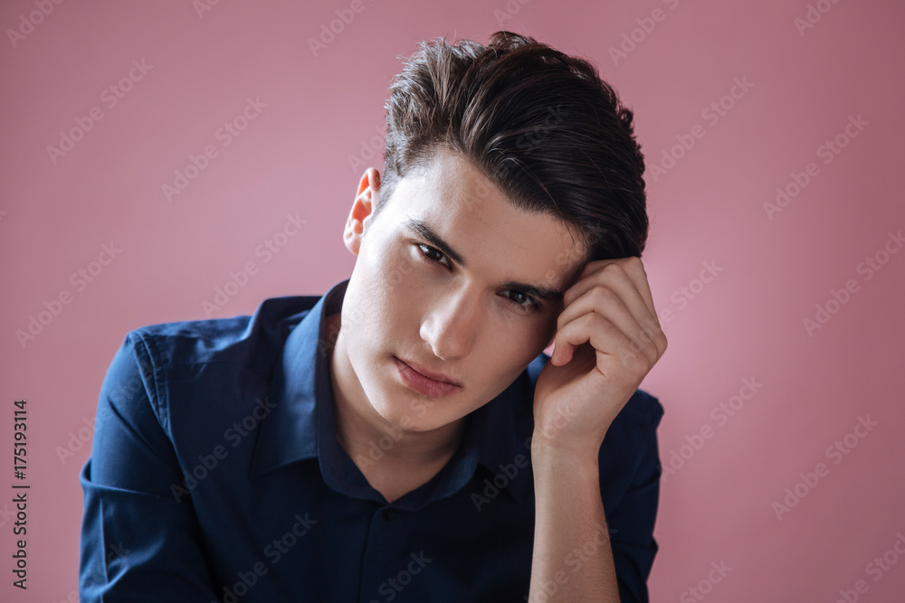 Portrait of delighted male that looking forward Portrait of delighted male that looking forward