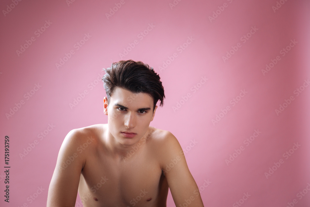 Concentrated male person staring at camera Concentrated male person staring at camera
