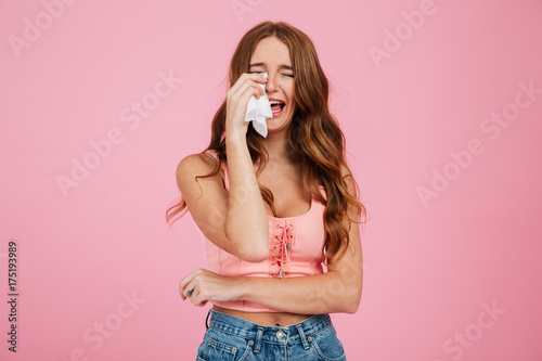 Wallpaper Mural Portrait of a sad young woman in summer clothes