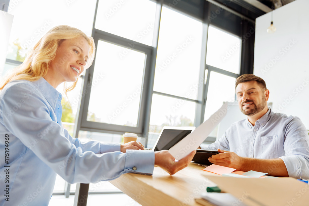 Delighted woman examining important document Delighted woman examining important document