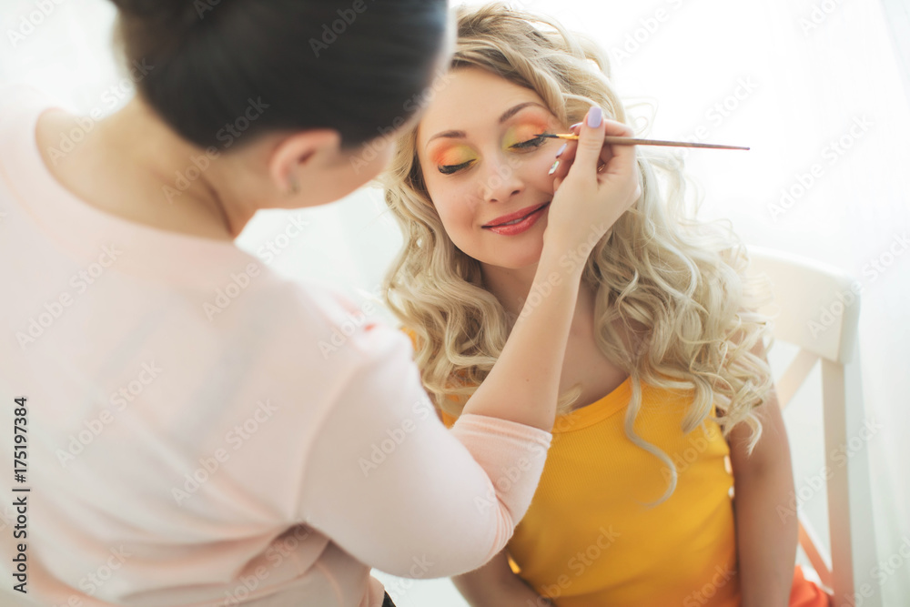 A woman doing makeup 