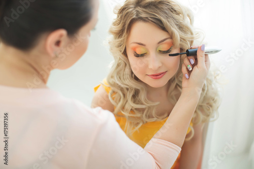 A woman doing makeup 