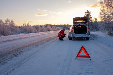 Broken on a snowy winter road