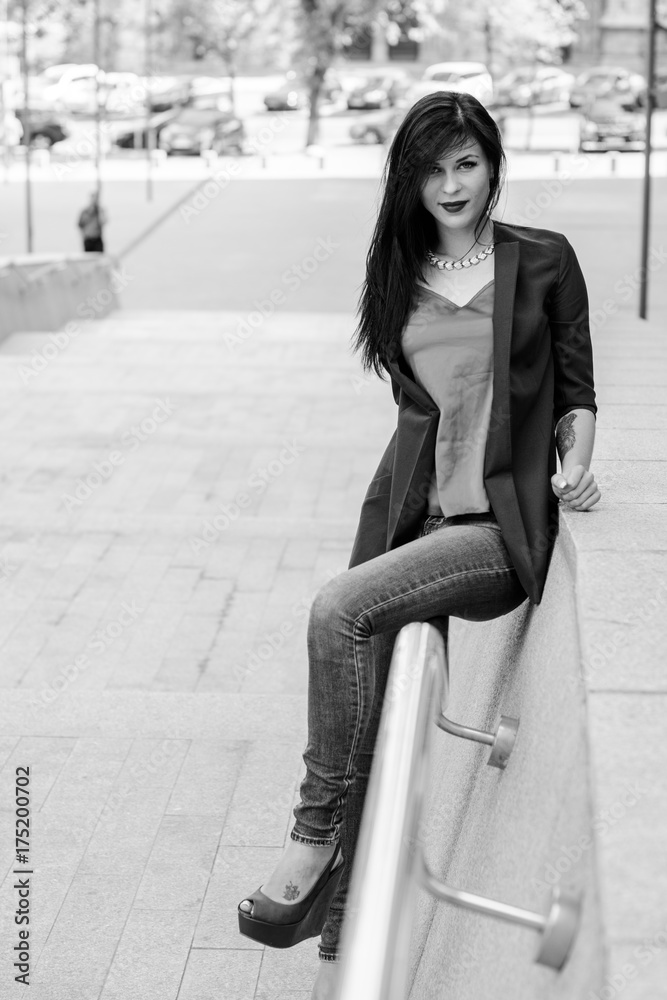 Pretty brunette European woman walk on a old city center and streets Pretty brunette European woman walk on a old city center and streets