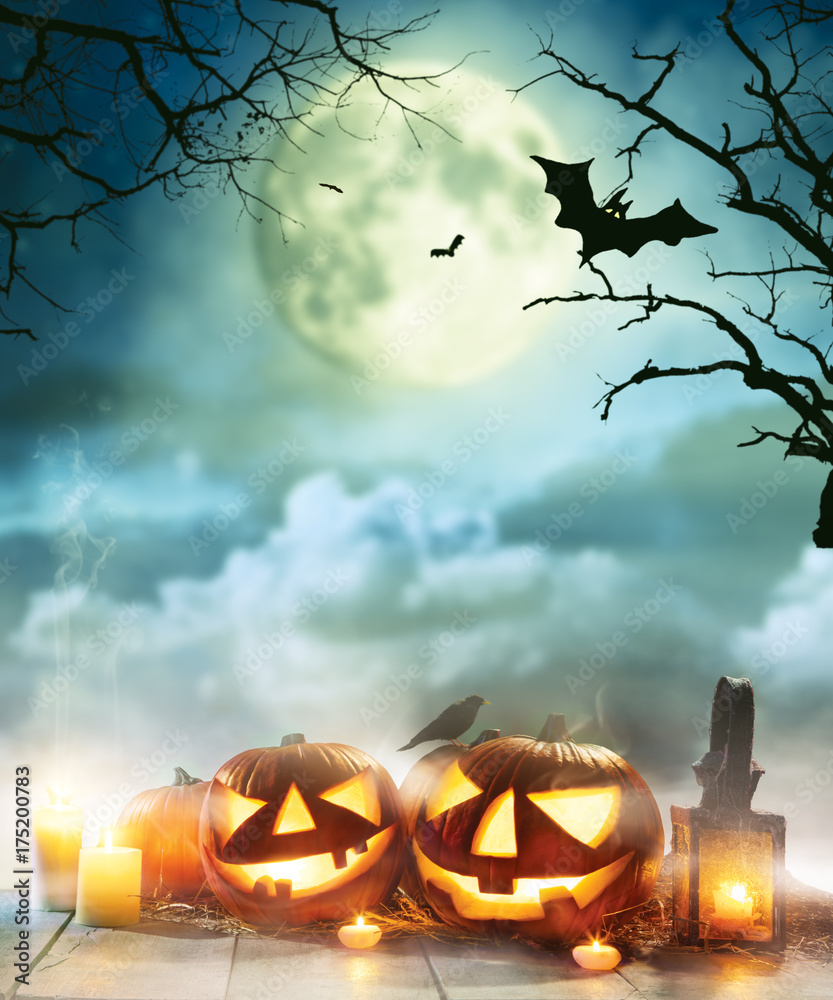 Fototapeta premium Spooky halloween pumpkins on wooden planks