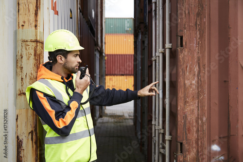 Docker using walkie talkie at dockyard to discuss container
