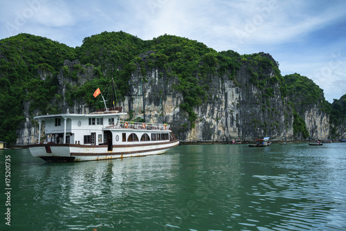Halong bay with tourist junks and rocky islands. Popular landmark, famous destination of Vietnam