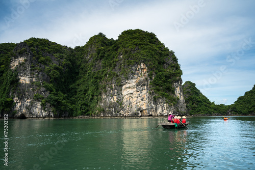 Halong bay in Vietnam, UNESCO World Heritage Site, with tourist rowing boats © Hanoi Photography