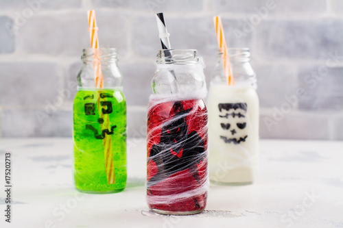 Assortment of Halloween drinks on white background. Copy space