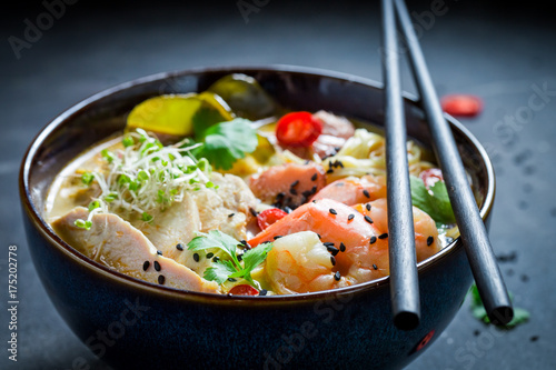 Yummy Malaysian Soup with chicken and shrimps