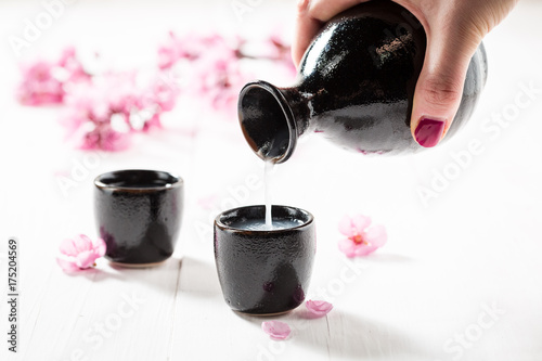 Prepared to drink sake with blooming flowers