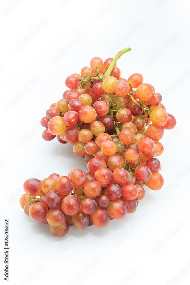 Ripe red grape. Pink bunch isolated on white.