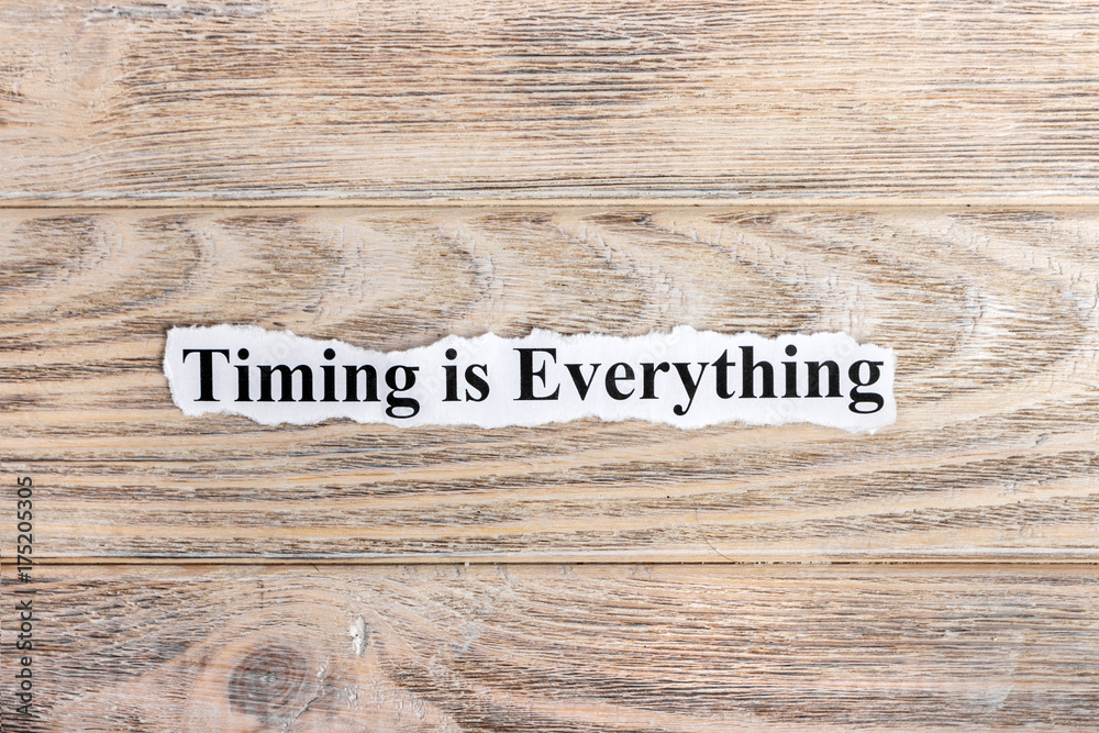 Timing is Everything text on paper. Word Timing is Everything on torn