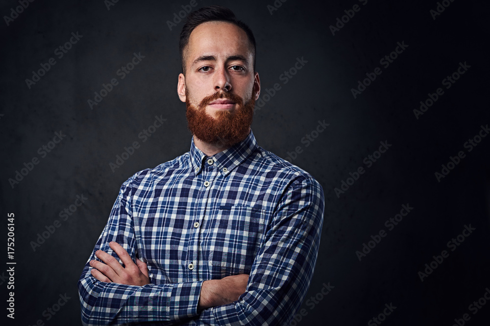 A man with crossed arms, dressed in a blue fleece shirt. A man with crossed arms, dressed in a blue fleece shirt.