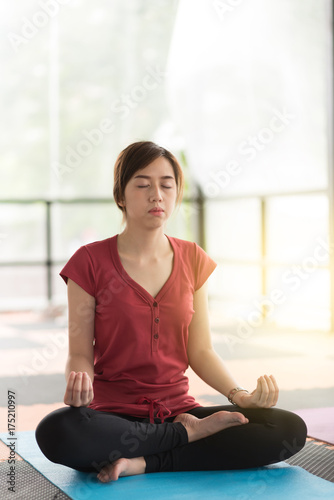 Woman doing yoga in the class
