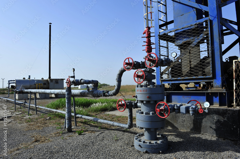 Fototapeta premium The pipe and valve oil fields