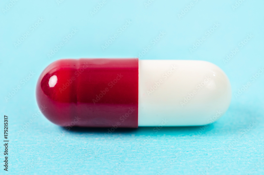 Red and white pills capsule. Red and white pills capsule.