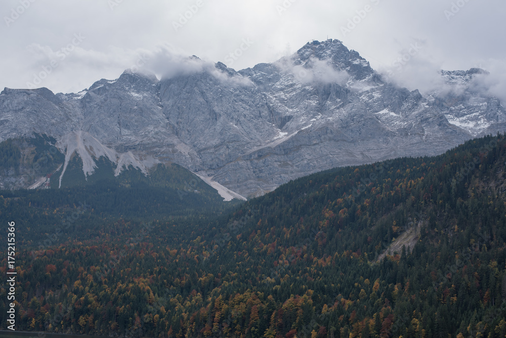 misty and cloudy mountains and autumn trees in Bavaria near Zugspitze