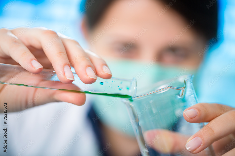 Girl laboratory assistant in the chemical laboratory of the university experiment with chemical reagents Girl laboratory assistant in the chemical laboratory of the university experiment with chemical reagents