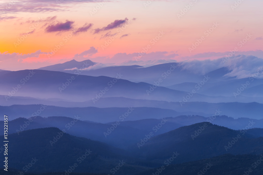 evening mountain valley in a blue mist