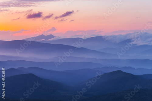 Fototapeta Naklejka Na Ścianę i Meble -  evening mountain valley in a blue mist