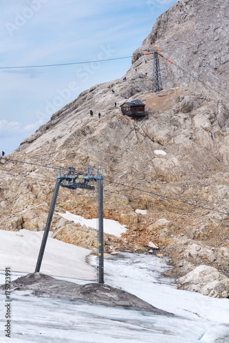 People hiking on Gjaidstein Mountain adventure trail near Dachstein, Austria photo