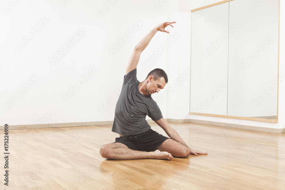 Pilates instructor performing fitness exercise at the gym indoor Pilates instructor performing fitness exercise at the gym indoor