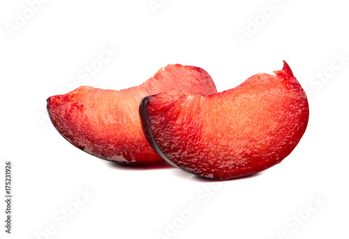 Two slices red plum
