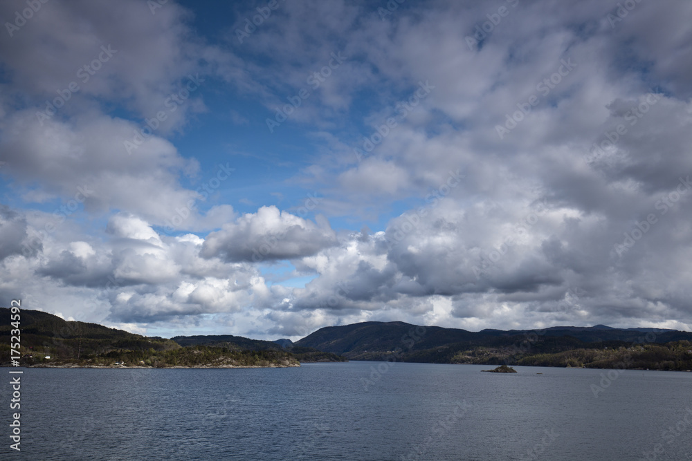 sea with smooth water and dramatic cloudy sky