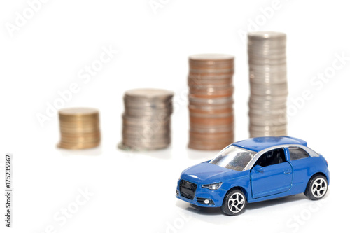toy car and stack of coin isolated on white background