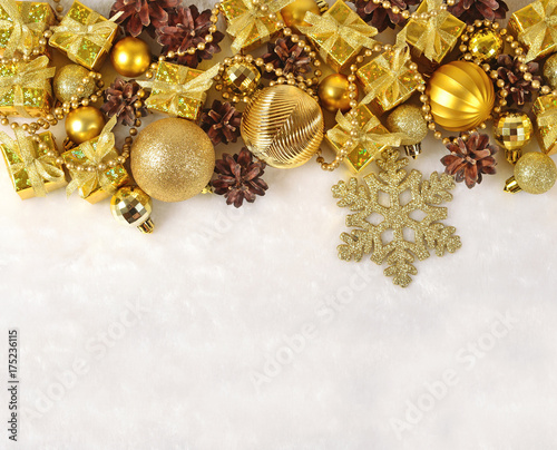Golden Christmas decorations on a white