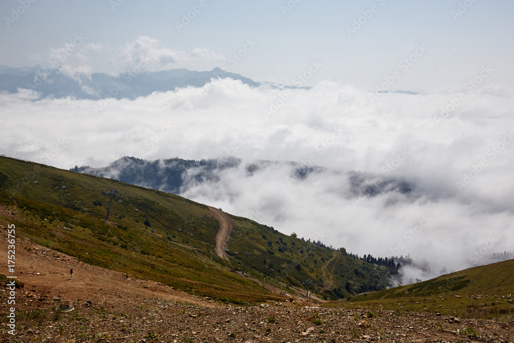 Beautiful clouds and fog among mountain landscape.