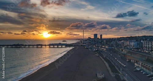 Aerial time lapse view of the seafront in Brighton at sunset (hyperlapse)