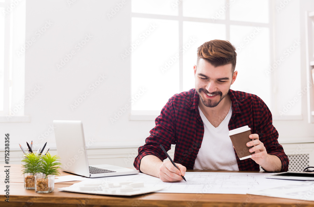 Young businessman working with papers Young businessman working with papers