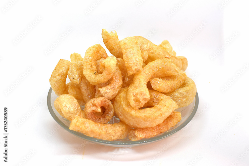 Pork cracklings on white background for traditional north Thai food concept. Pork cracklings on white background for traditional north Thai food concept.