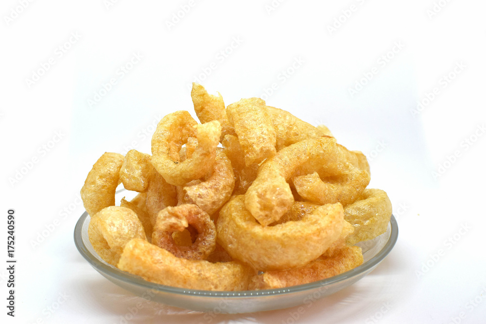 Pork cracklings on white background for traditional north Thai food concept. Pork cracklings on white background for traditional north Thai food concept.